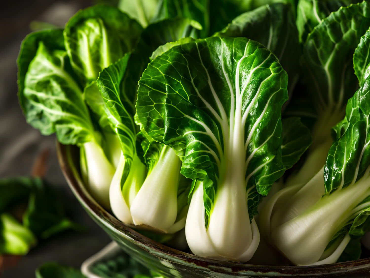 Bok choy leaves in a ceramic bowl