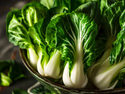 Bok choy leaves in a ceramic bowl